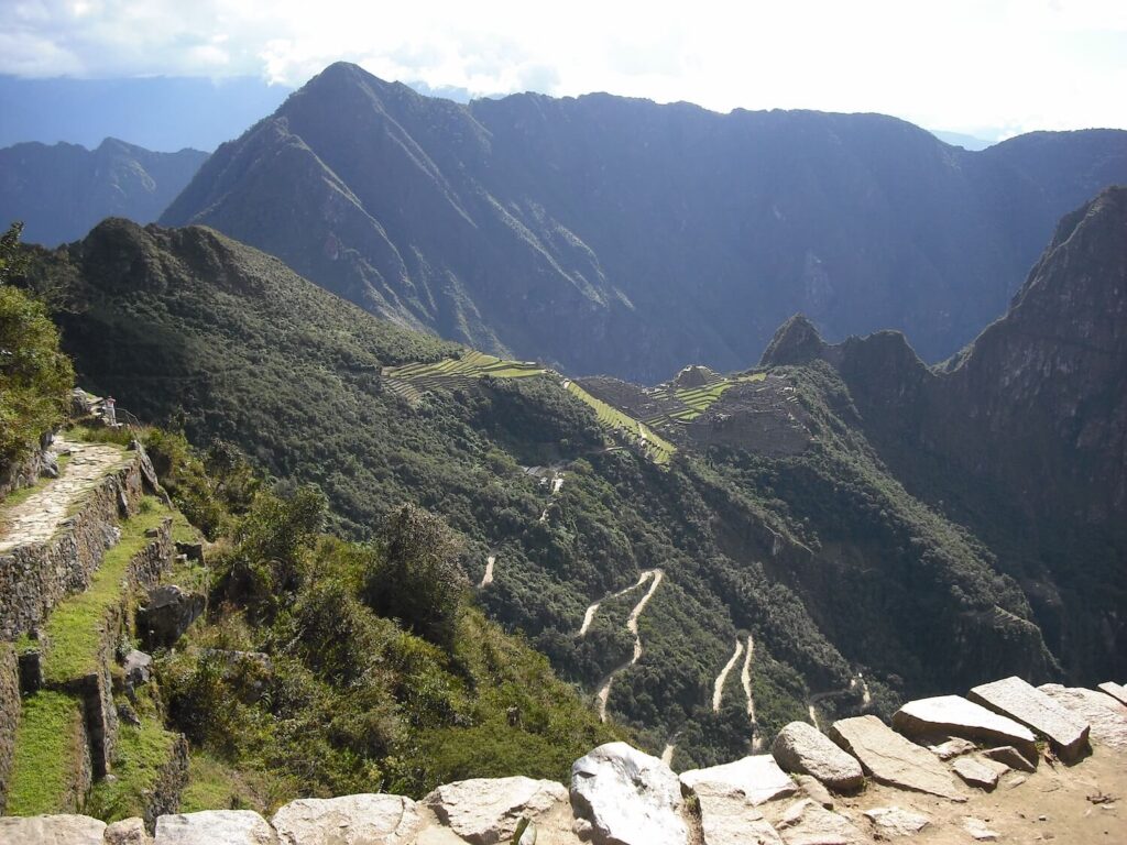Panoramic view of Machu Picchu from the Sun Gate with mountain trails and the Urubamba Valley below